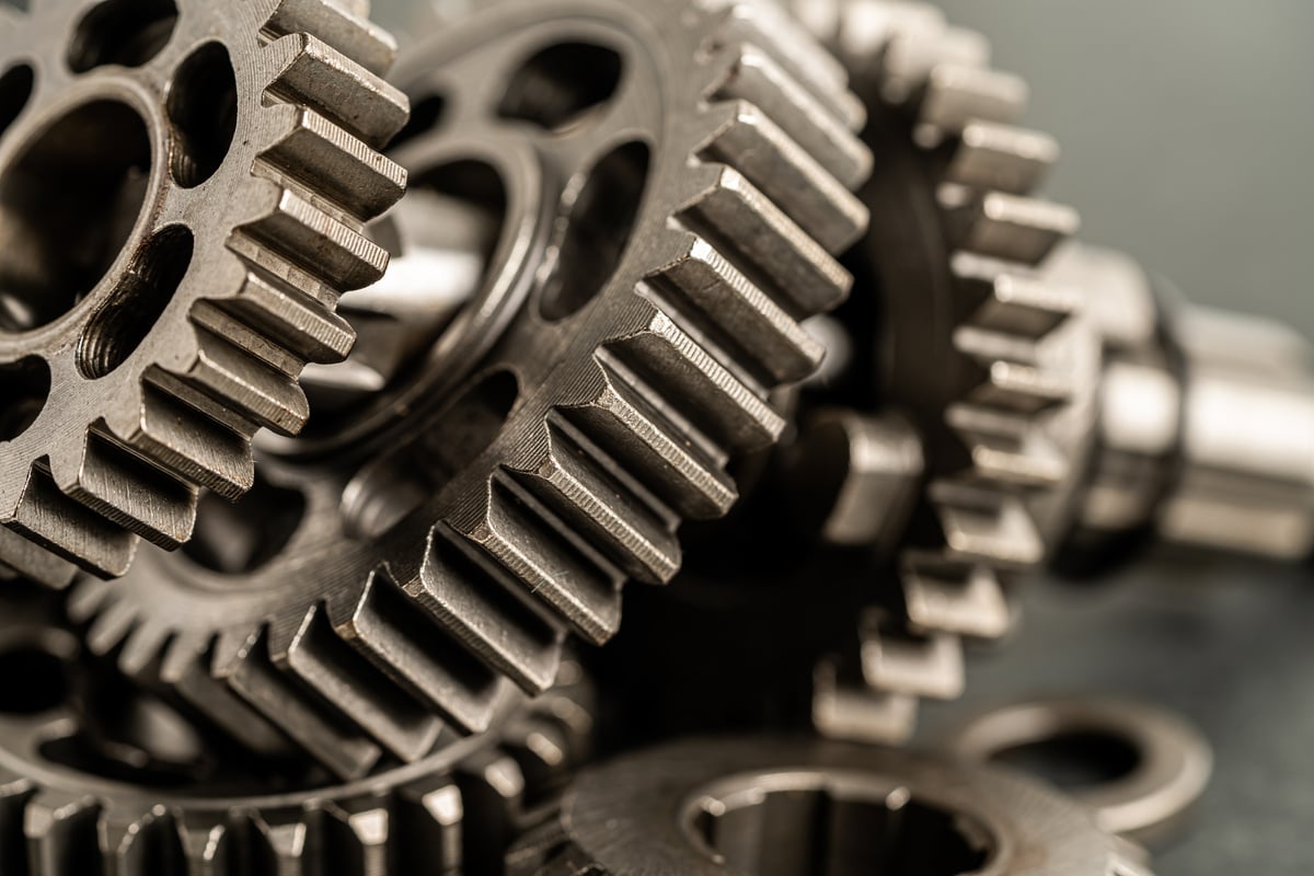 Gear and cogs wheels, clock mechanism, brass metal engine industrial.